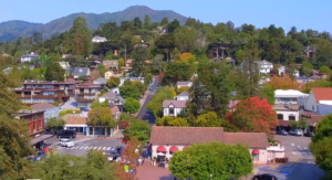 Aerial view of downtown Mill Valley with houses and tree-lined streets